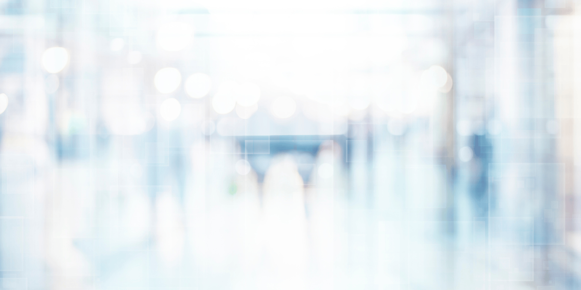 gray wooden table beside wing chair