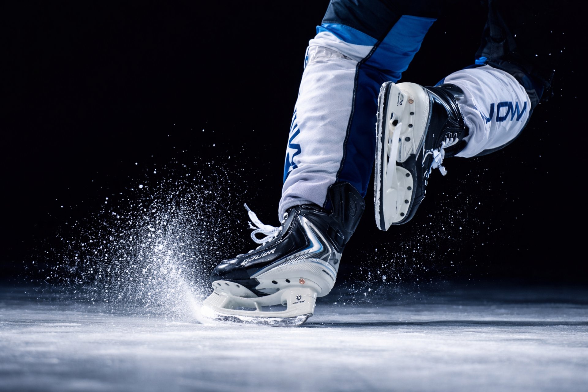 an abstract photo of a curved building with a blue sky in the background