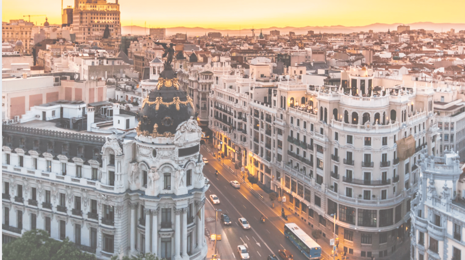 an abstract photo of a curved building with a blue sky in the background