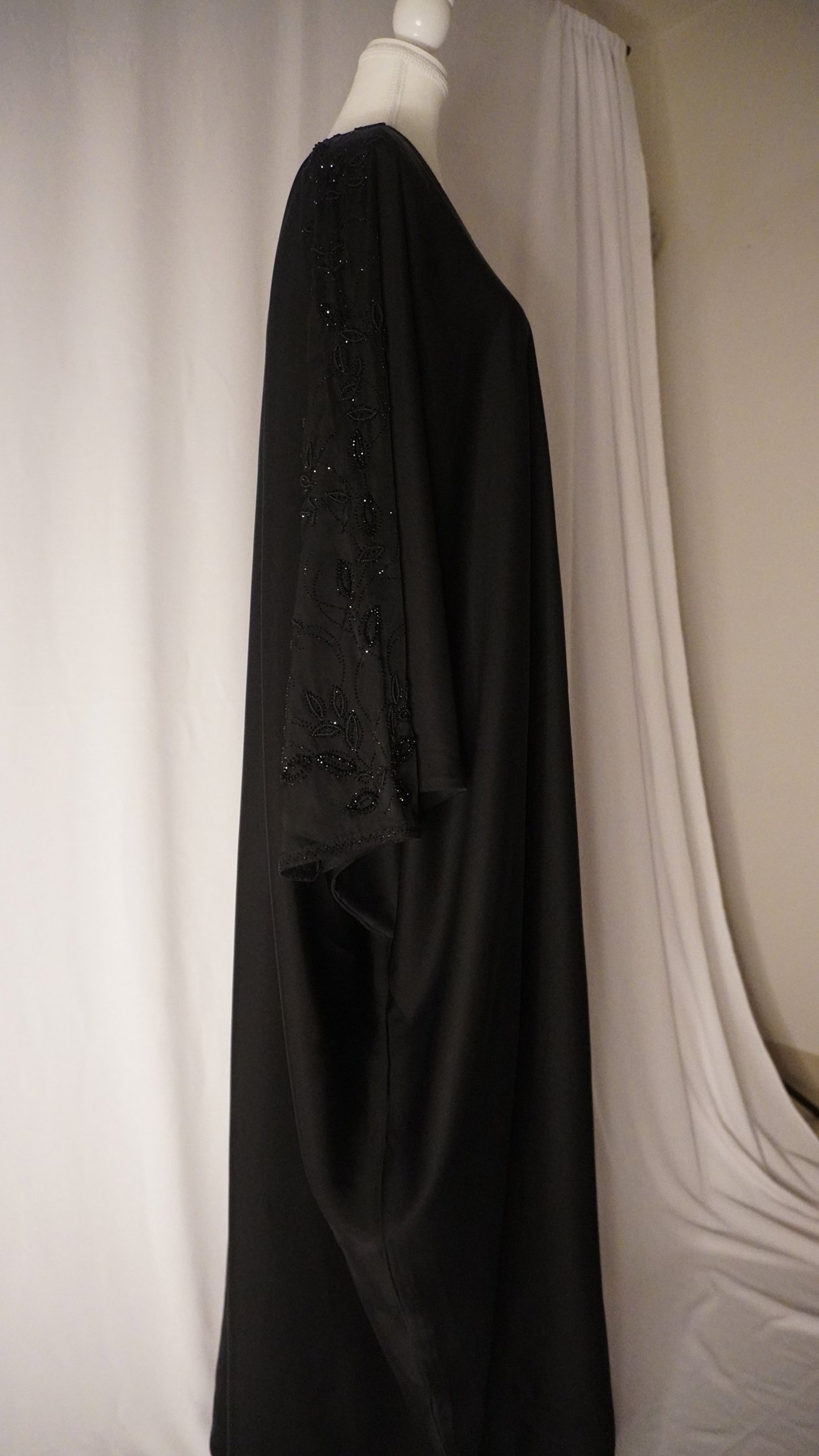 woman wearing yellow long-sleeved dress under white clouds and blue sky during daytime