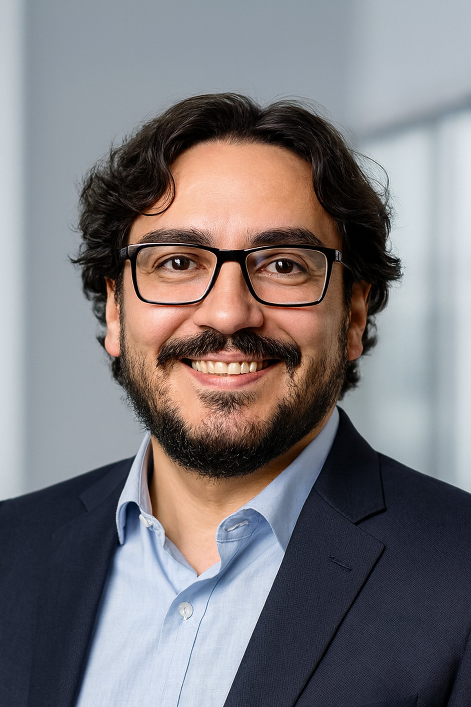 man self portrait wearing gray and white collared button-up shirt near green leaf plant with white ceramic pot