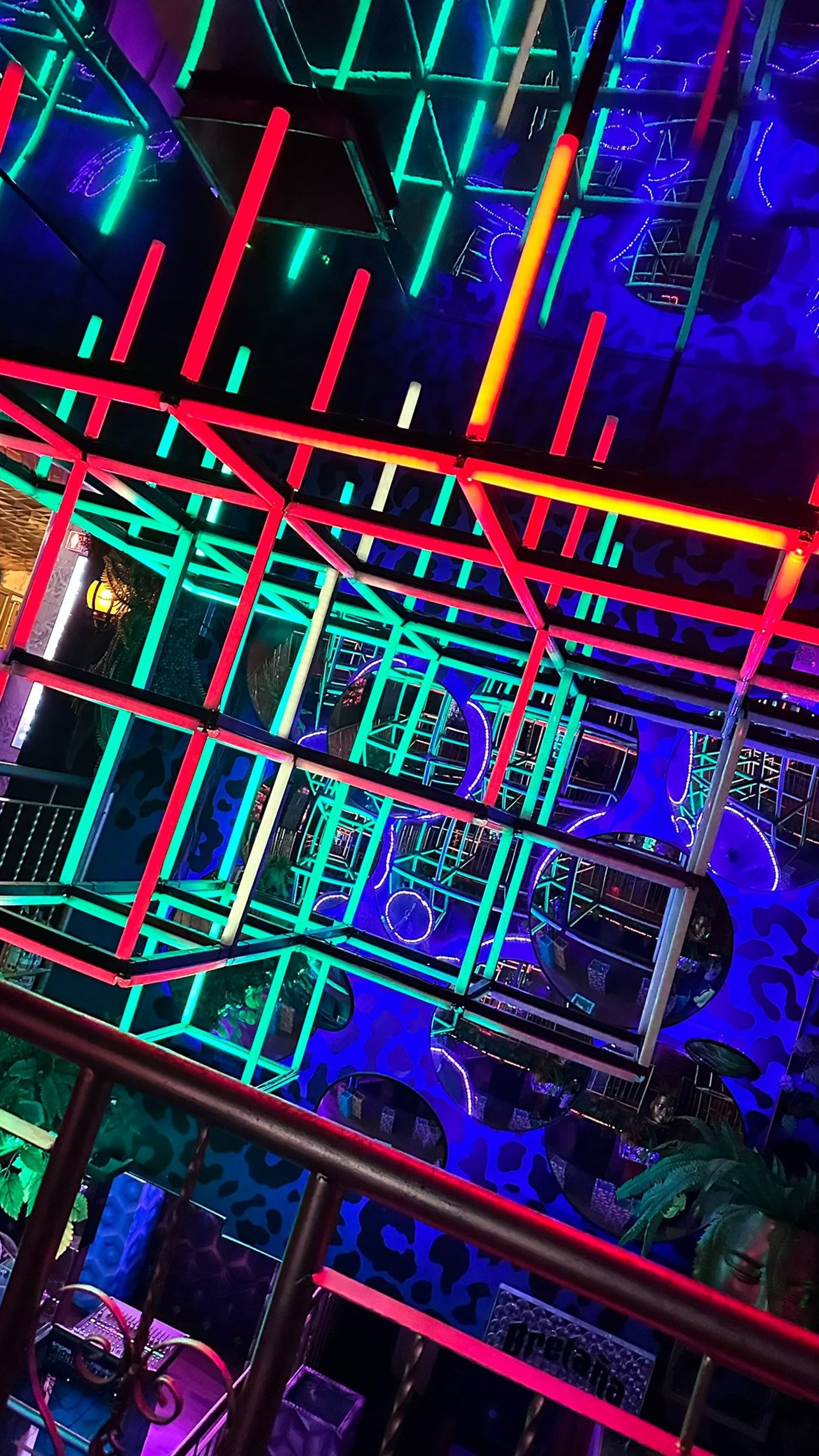 an abstract photo of a curved building with a blue sky in the background