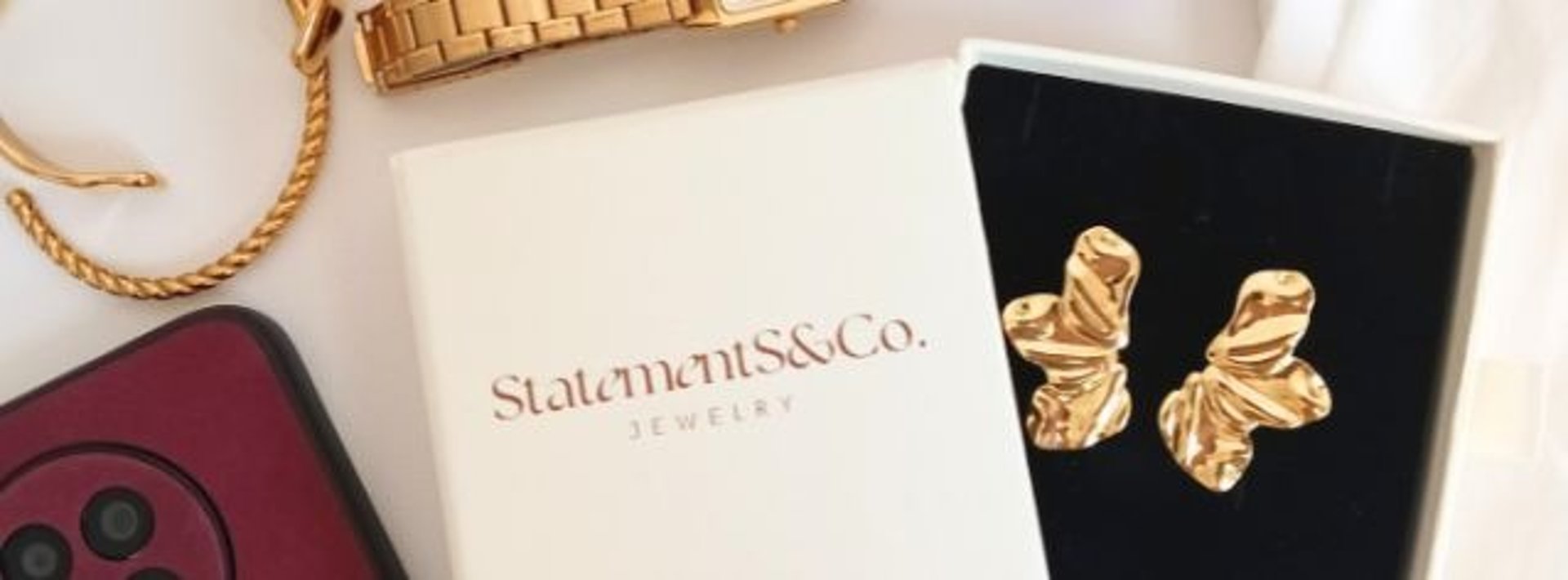 gold ring on white paper