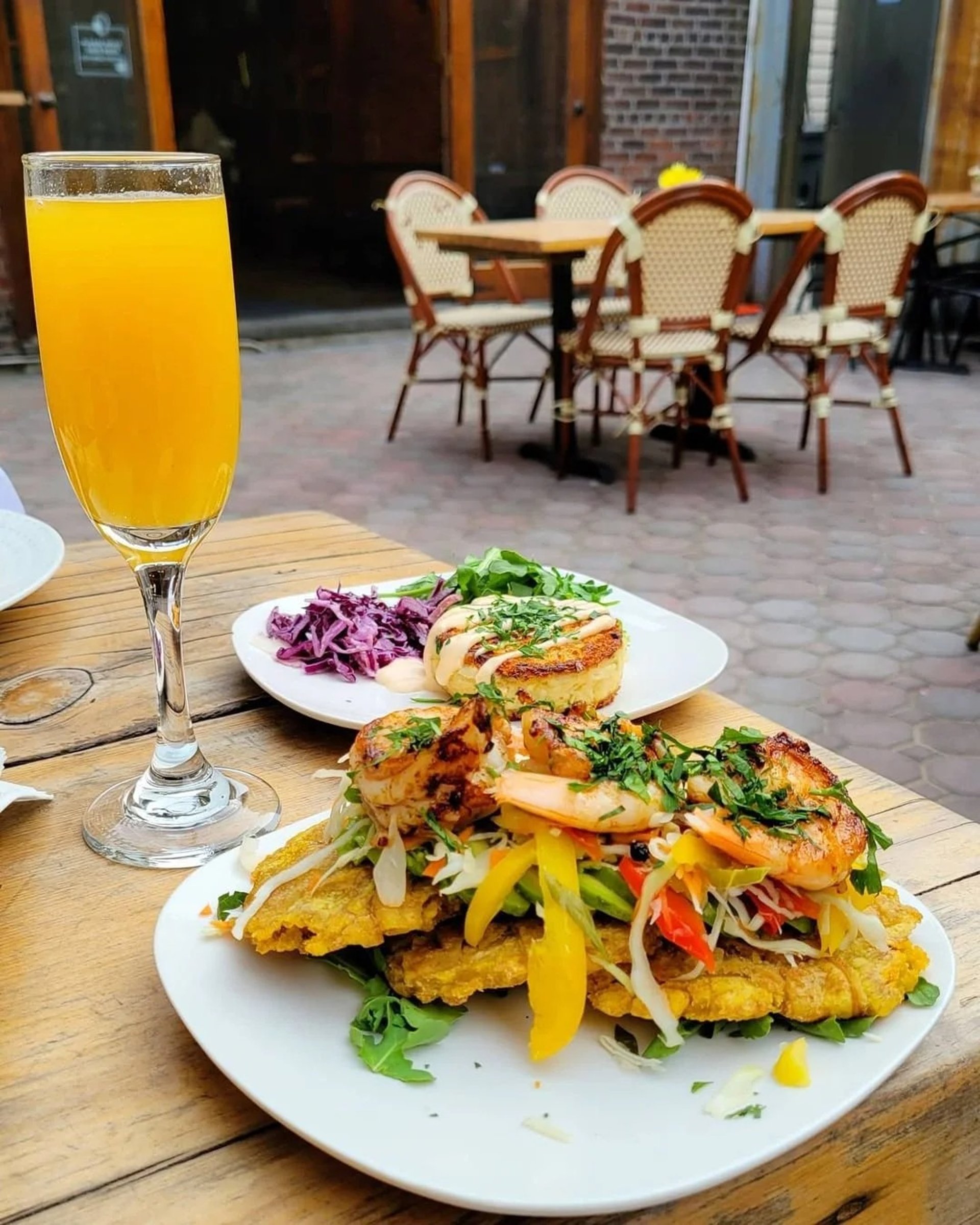 woman wearing yellow long-sleeved dress under white clouds and blue sky during daytime
