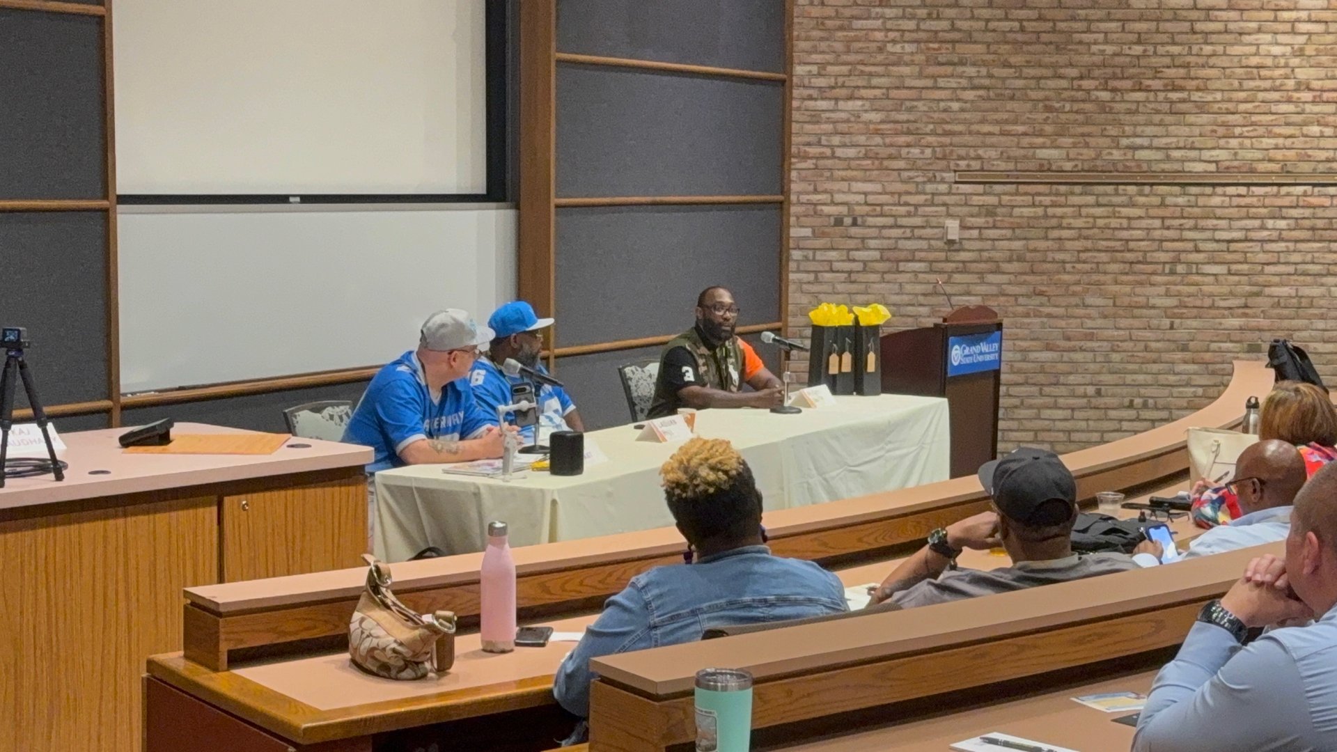 black and brown leather padded tub sofa