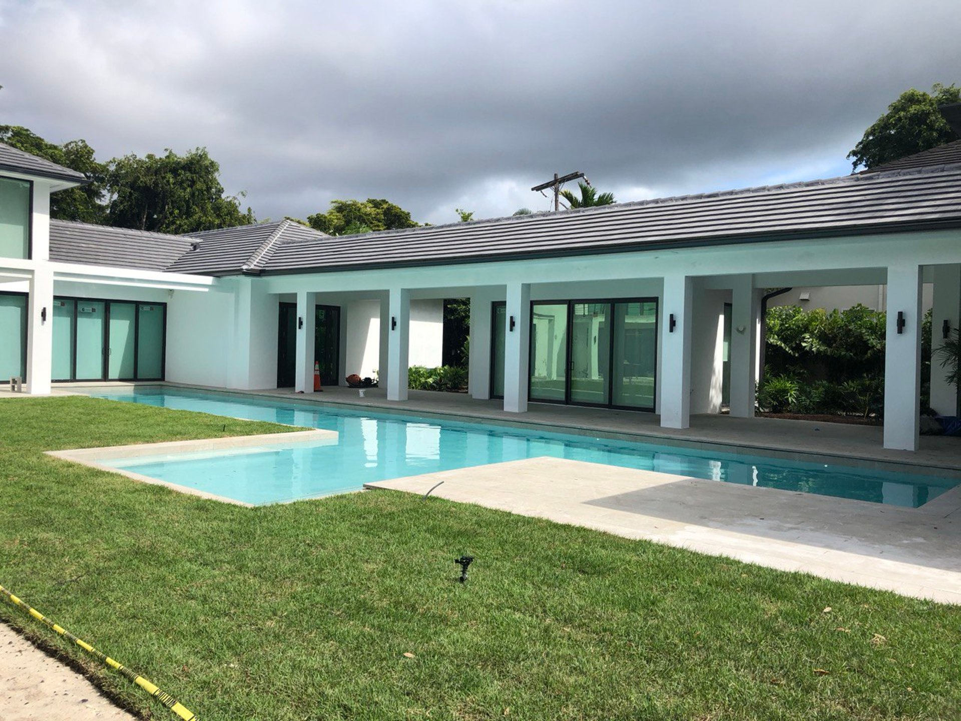an abstract photo of a curved building with a blue sky in the background