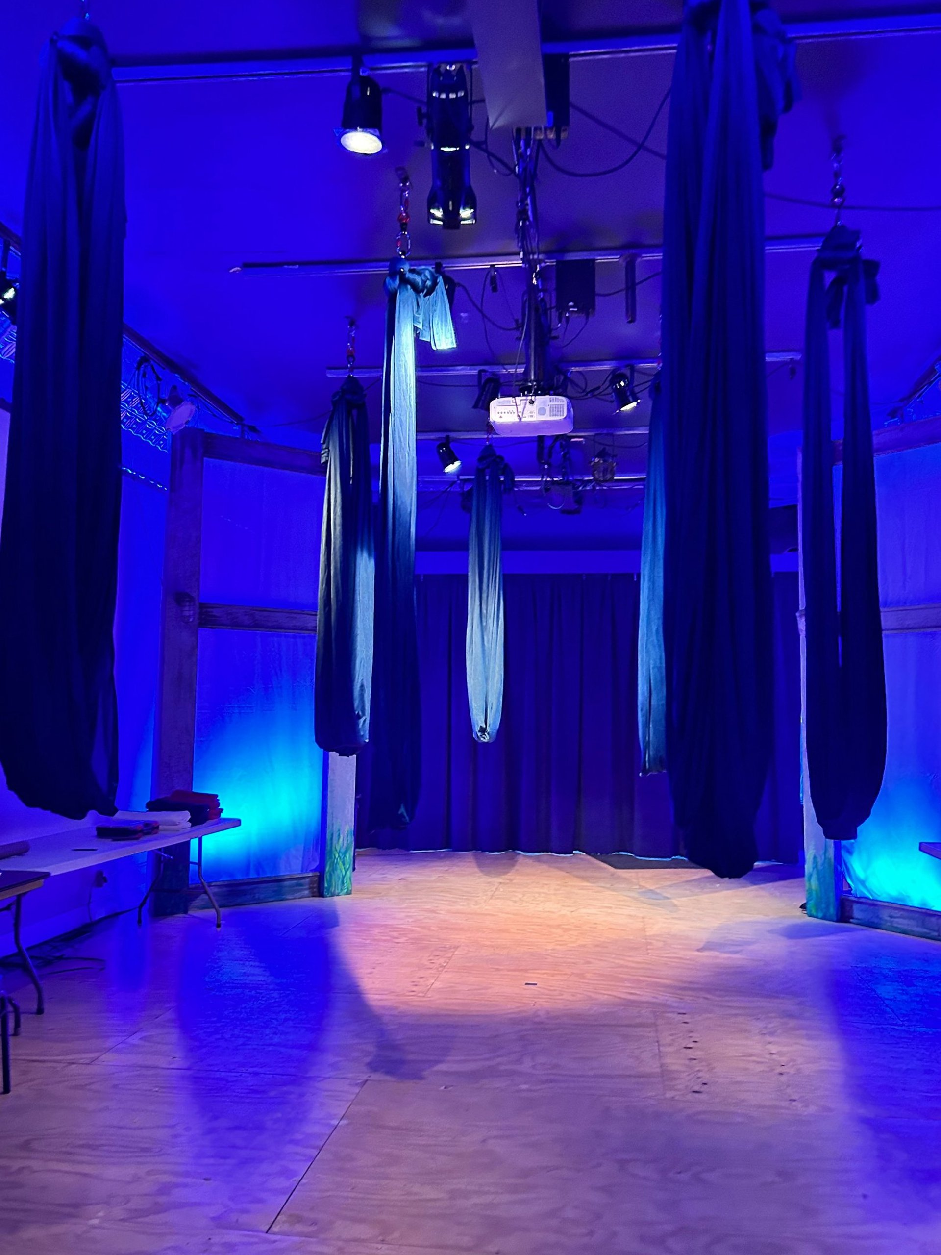 an abstract photo of a curved building with a blue sky in the background