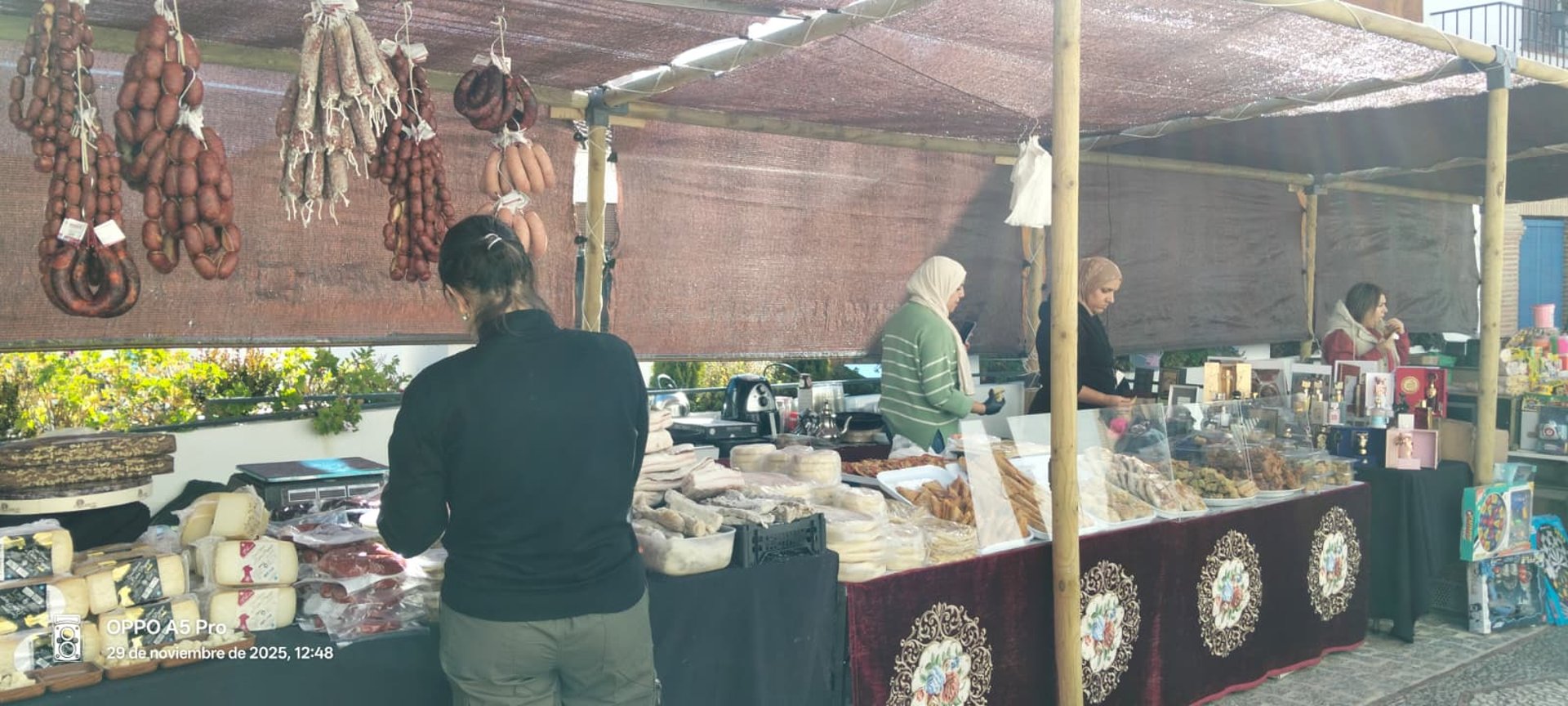 an abstract photo of a curved building with a blue sky in the background