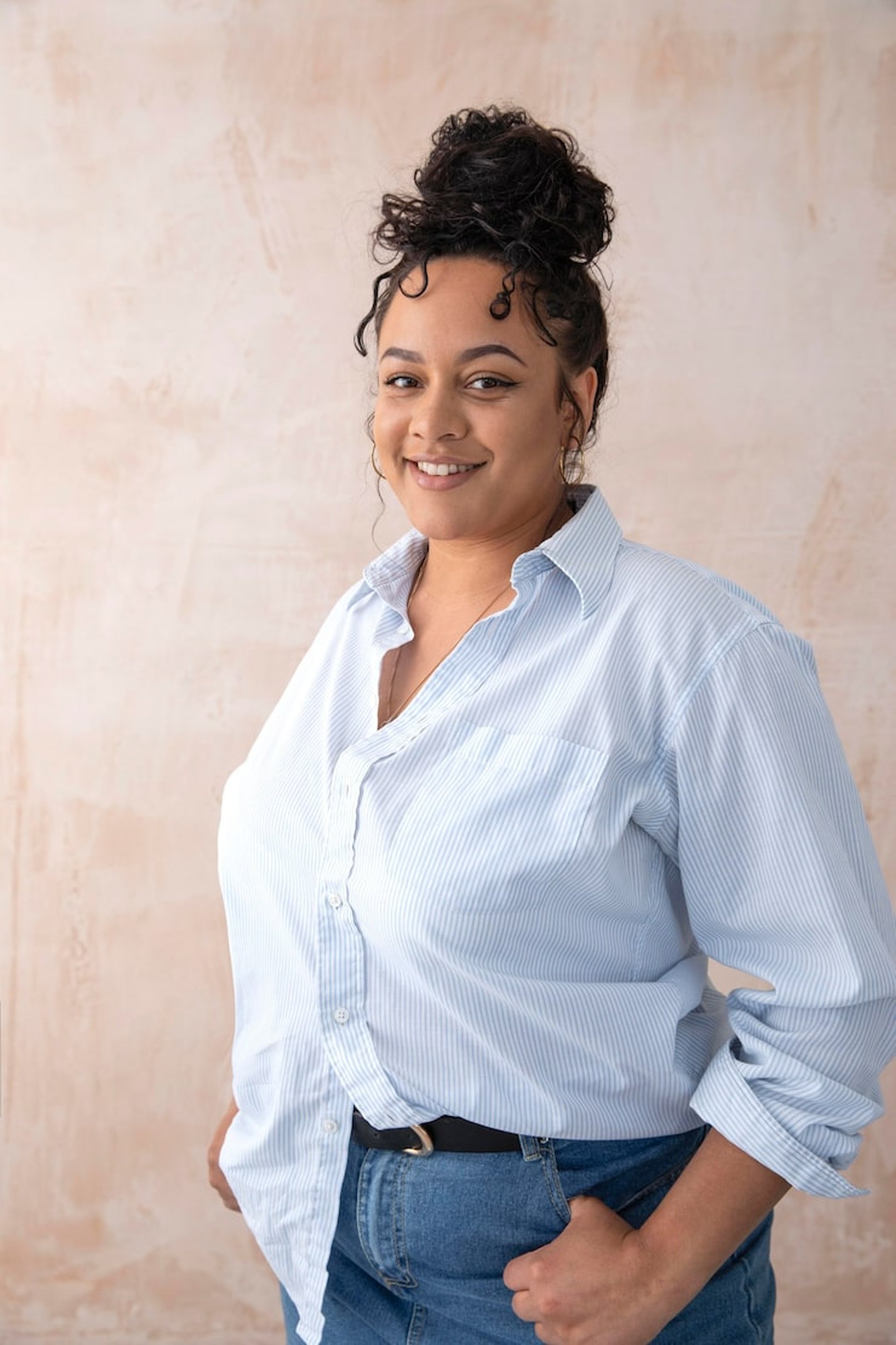 an abstract photo of a curved building with a blue sky in the background