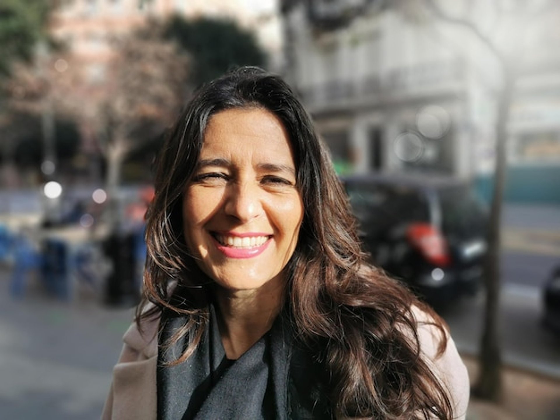 an abstract photo of a curved building with a blue sky in the background