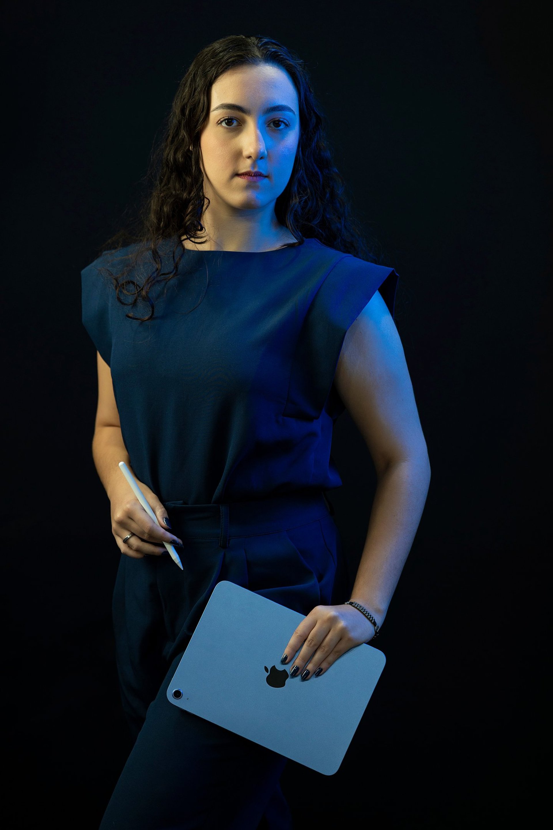an abstract photo of a curved building with a blue sky in the background