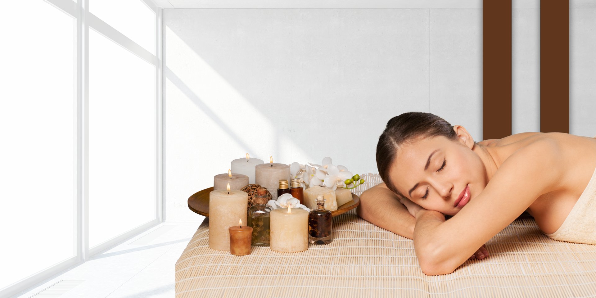 white plastic pump bottle beside pink tulips and gray towel