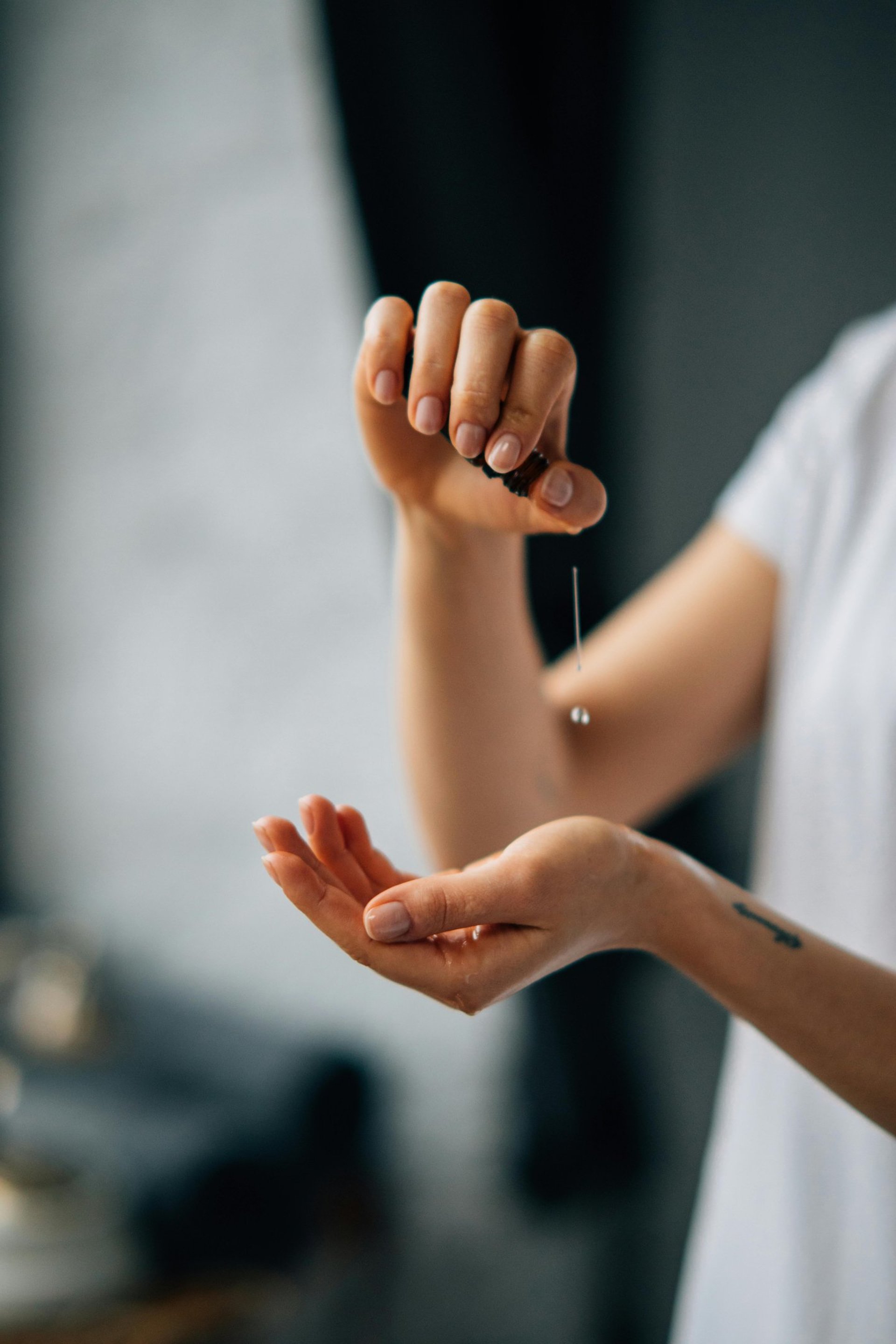 person holding dropper