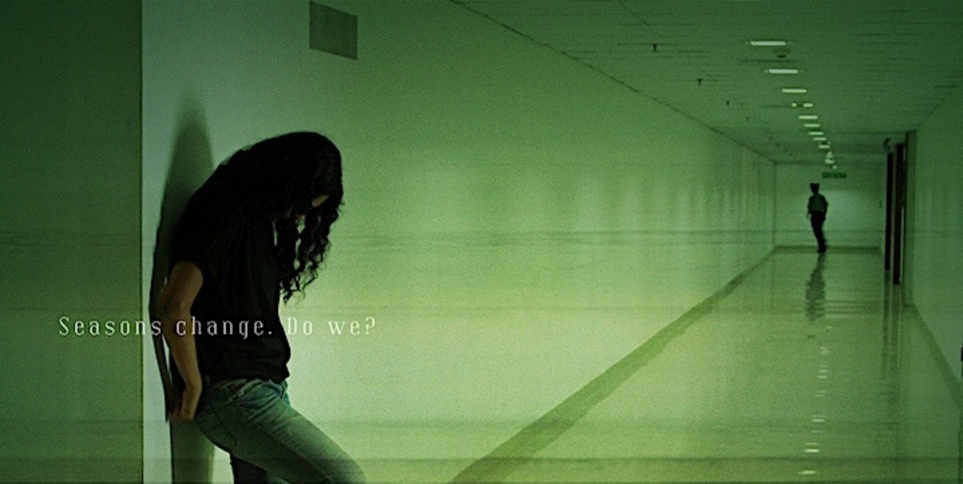 an abstract photo of a curved building with a blue sky in the background