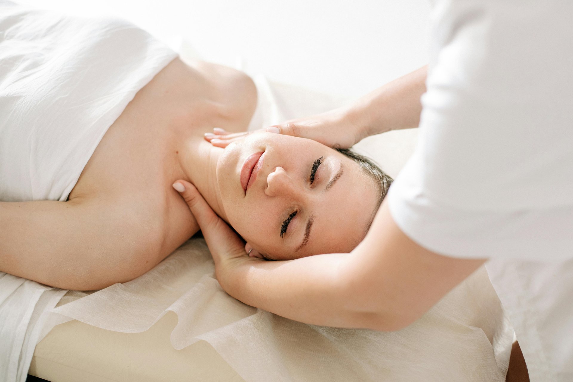 topless woman lying on bed