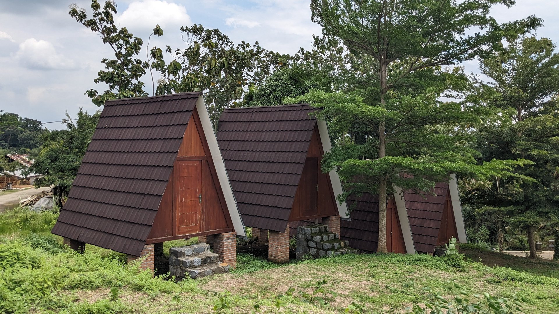 man and woman standing in front of brown concrete building during daytime
