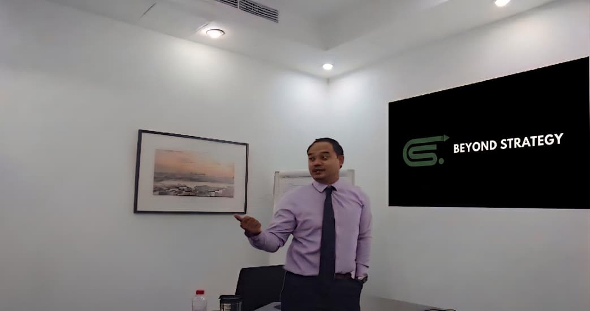 man standing in front of group of men