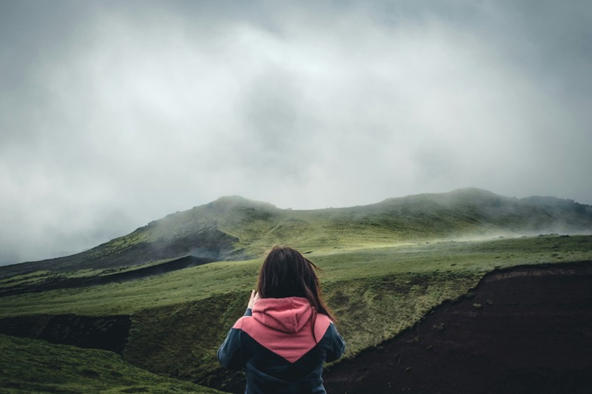 an abstract photo of a curved building with a blue sky in the background