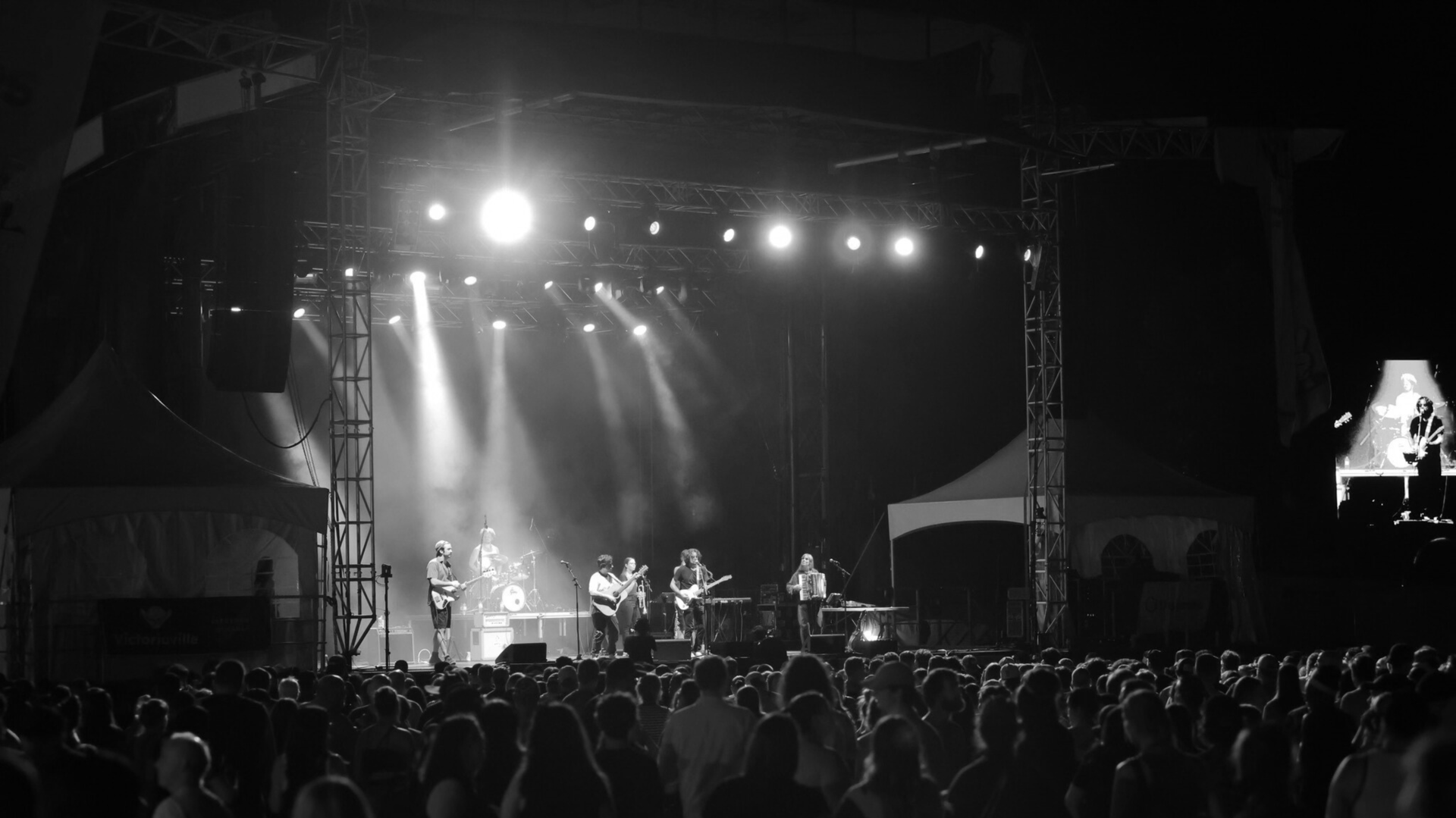 an abstract photo of a curved building with a blue sky in the background
