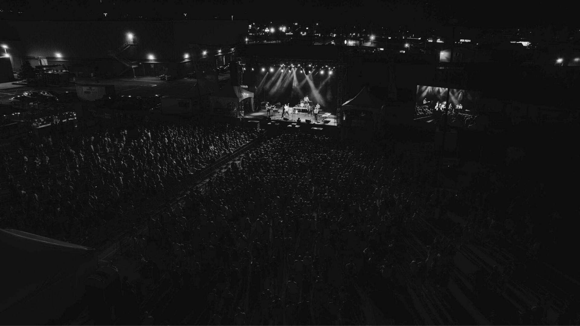 an abstract photo of a curved building with a blue sky in the background