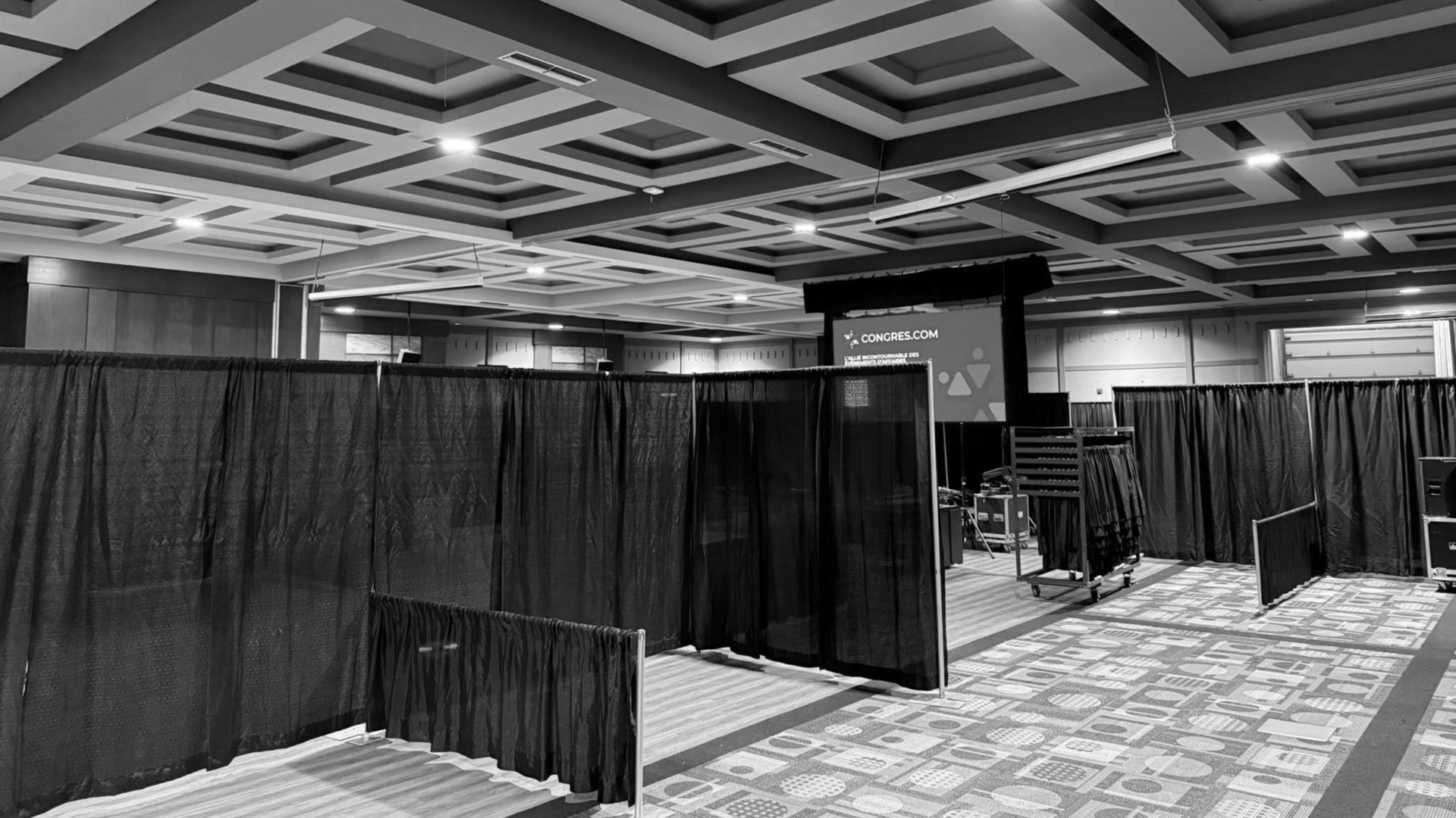 an abstract photo of a curved building with a blue sky in the background