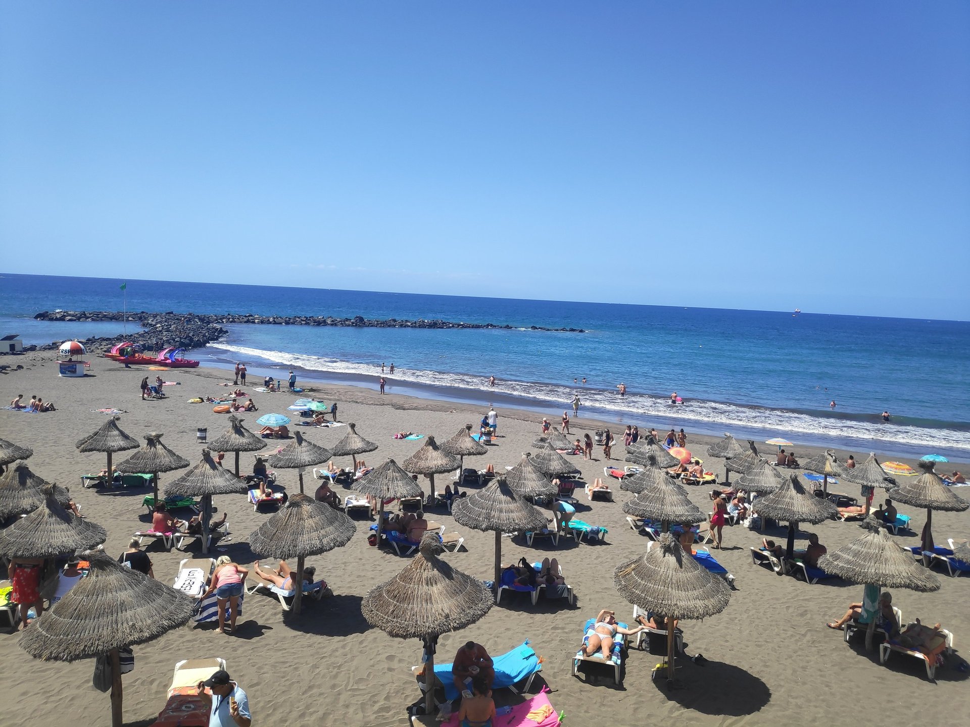 woman wearing yellow long-sleeved dress under white clouds and blue sky during daytime