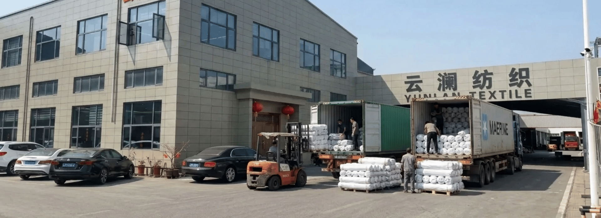Textile factory loading fabric shipments at woven fabric manufacturer