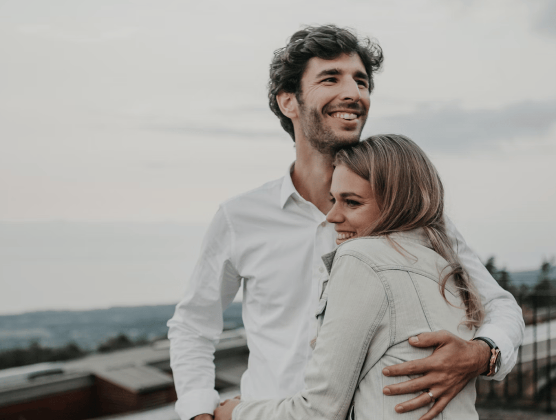 brown wooden bed frame with white and brown bed linen