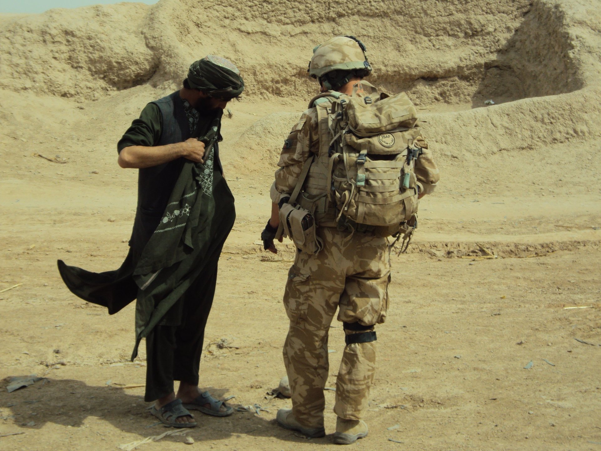 woman wearing yellow long-sleeved dress under white clouds and blue sky during daytime