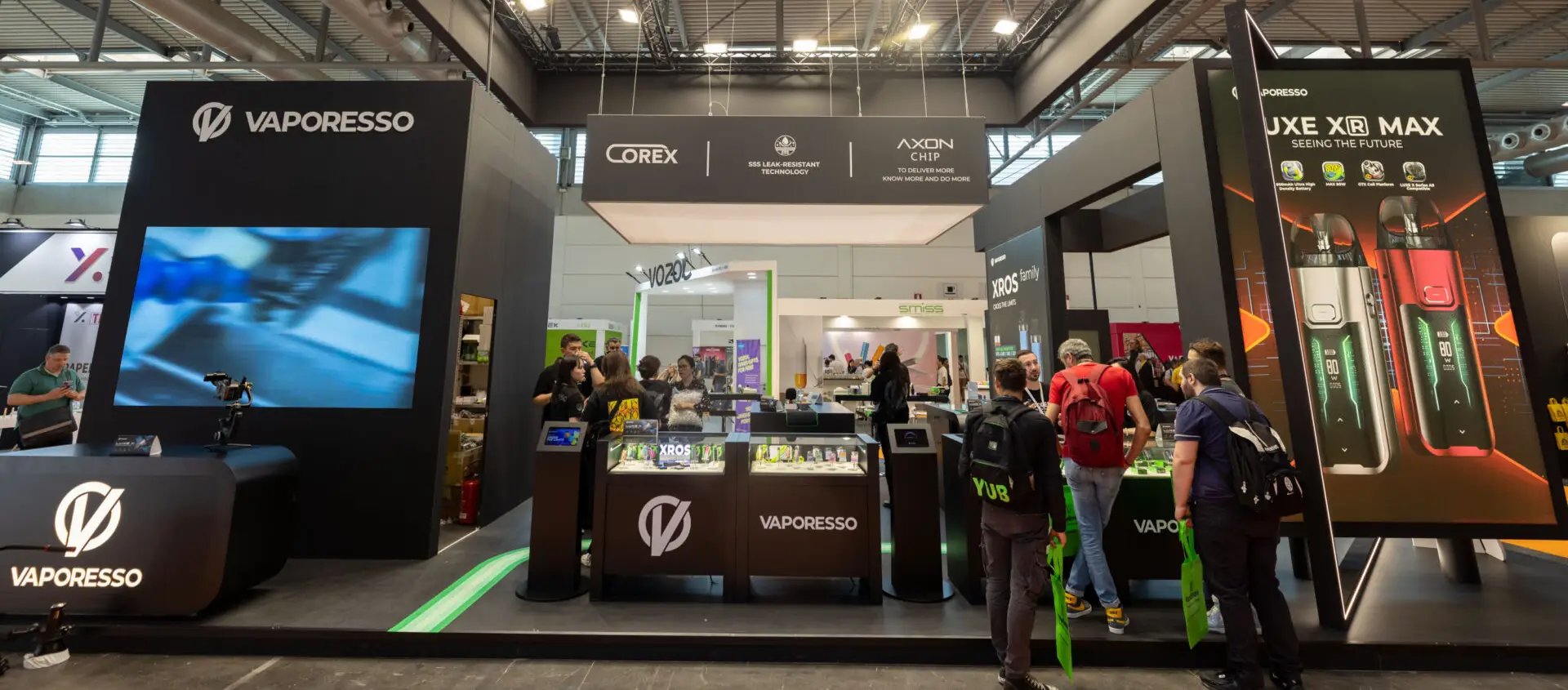 Modern exhibition booth with digital displays and professional presentation setup