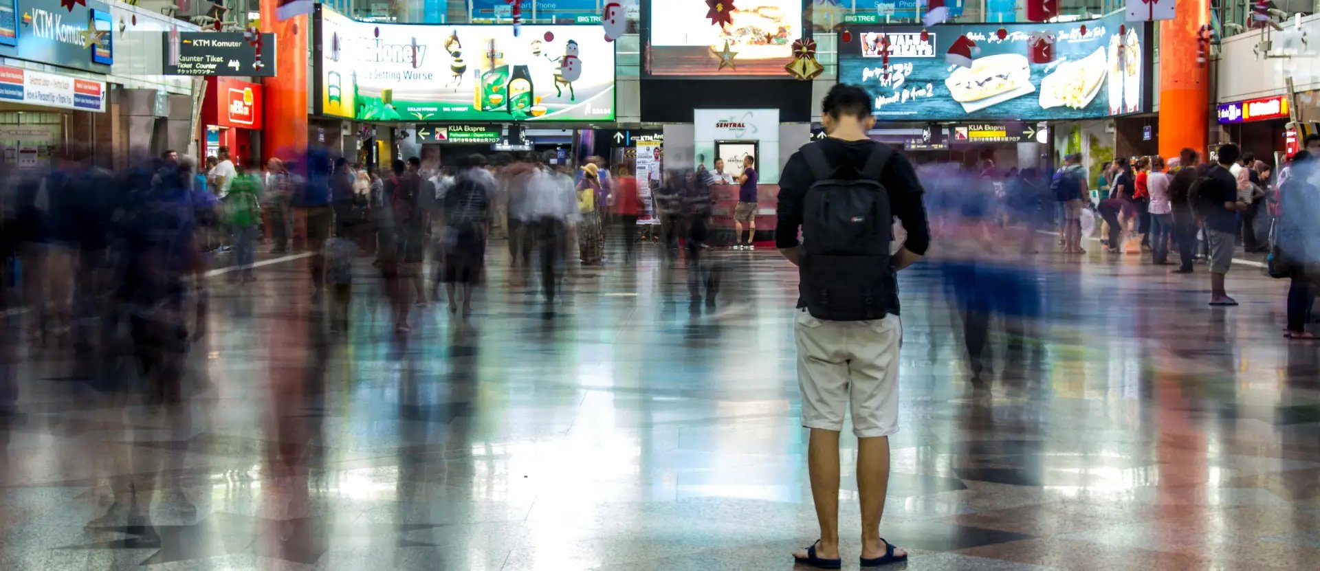 Busy trade show floor with exhibitors and visitors at industry exhibition