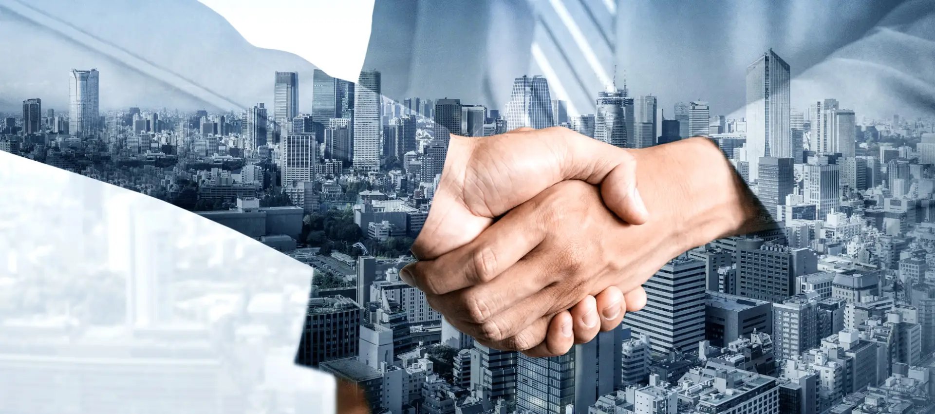 Business handshake over city skyline representing corporate partnership and deal making