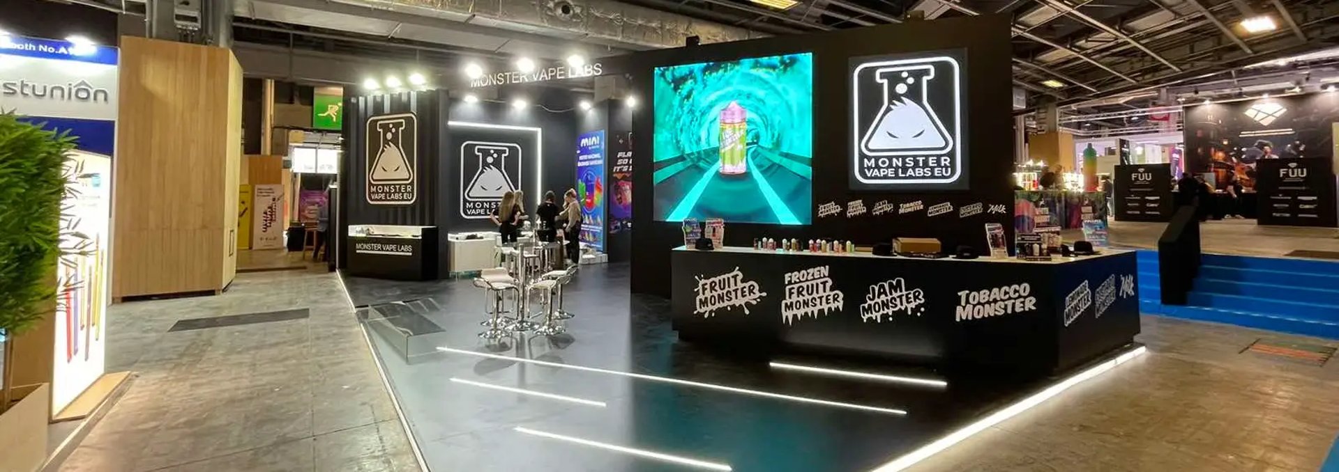 Sleek modern exhibition stand with illuminated branding and product displays