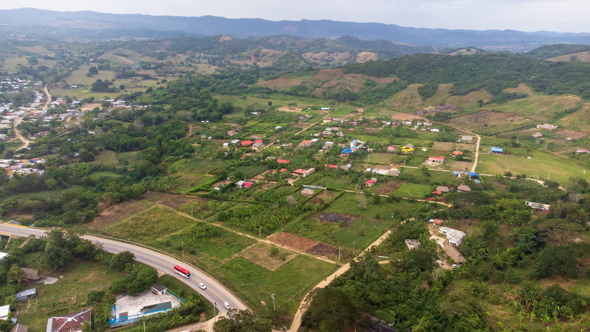 an abstract photo of a curved building with a blue sky in the background