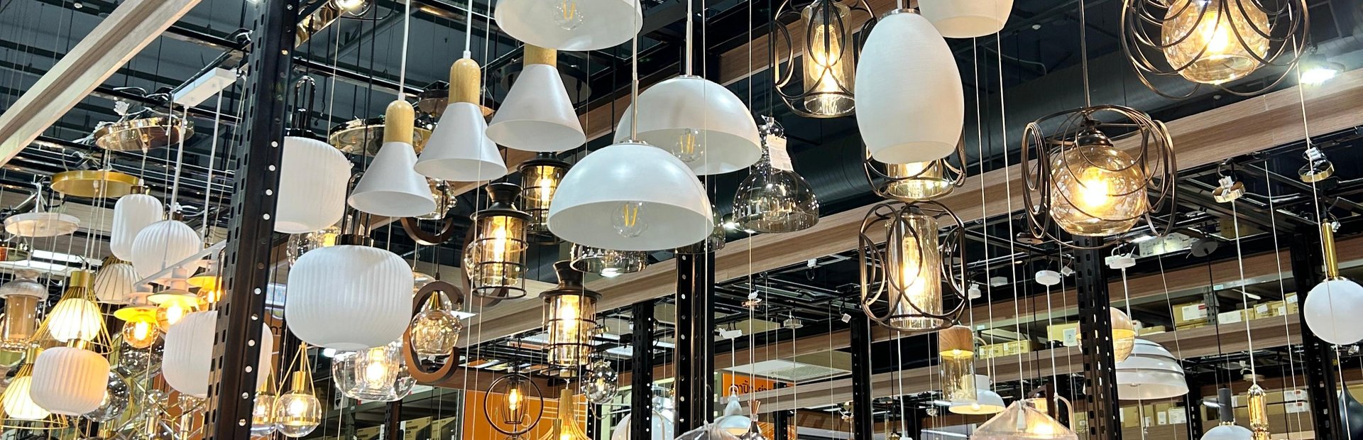 black and silver desk lamp on brown wooden table