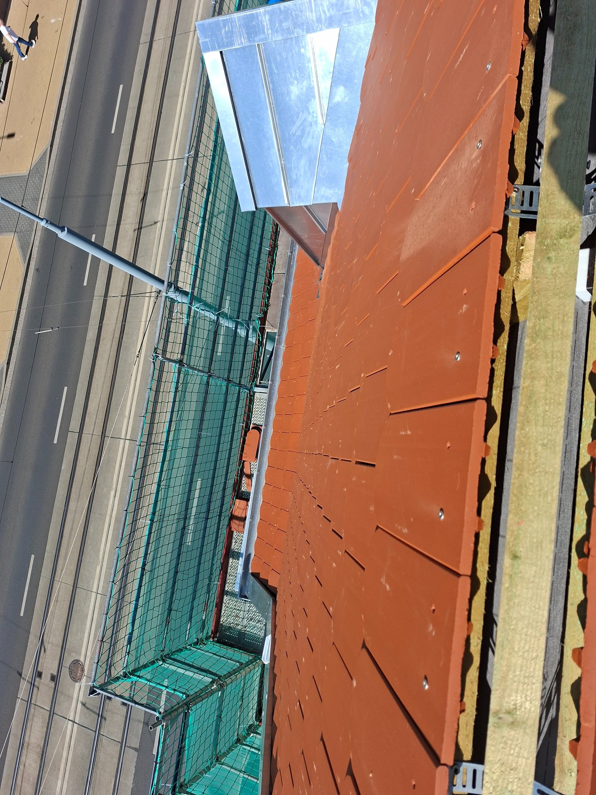 a man sitting on top of a metal structure
