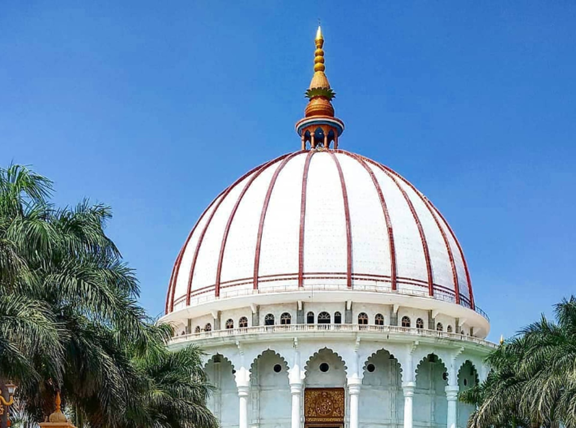 woman wearing yellow long-sleeved dress under white clouds and blue sky during daytime