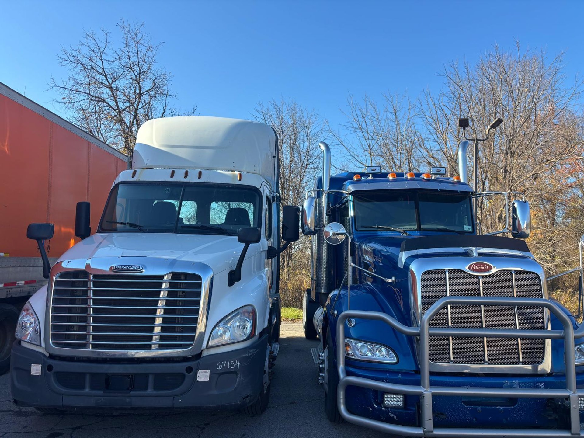 an abstract photo of a curved building with a blue sky in the background