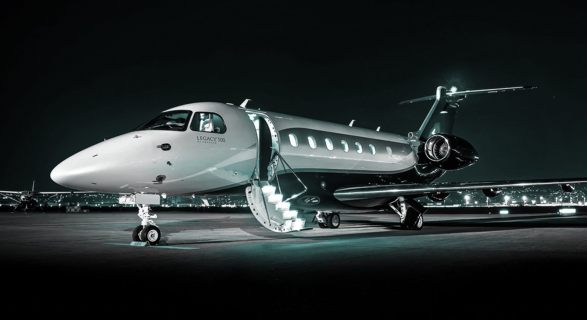 a jet sitting on top of an airport tarmac