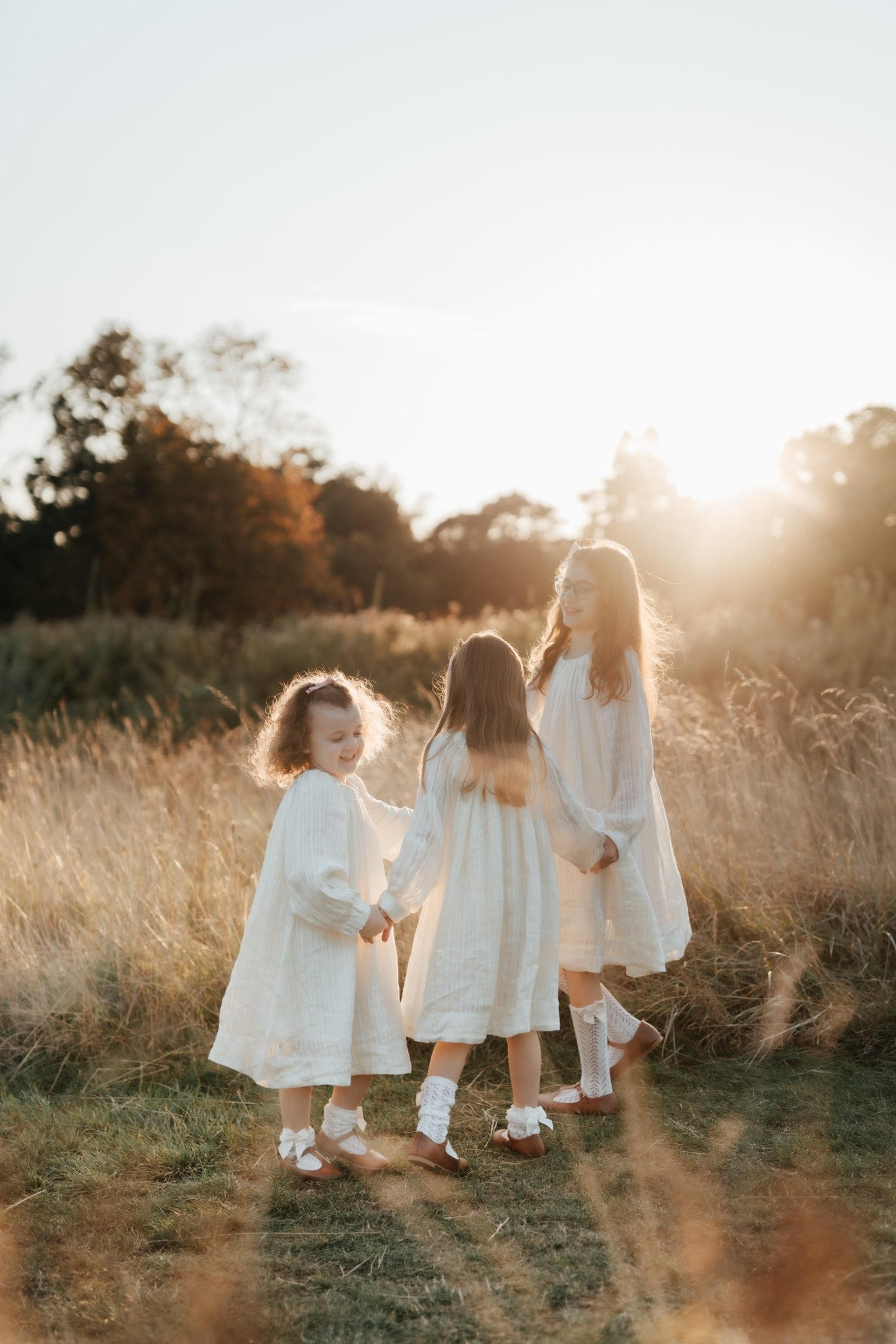 a bride and groom walking on a hill
