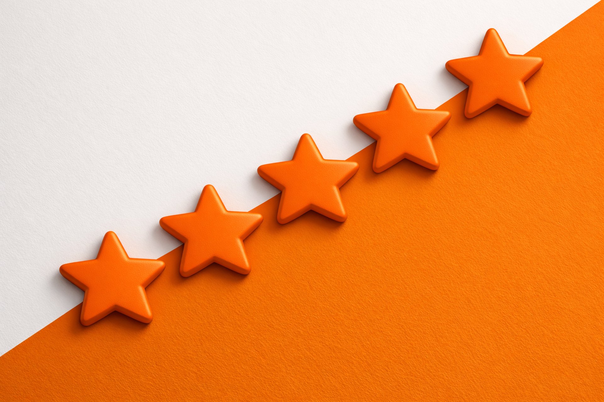 a row of yellow stars sitting on top of a blue and pink surface