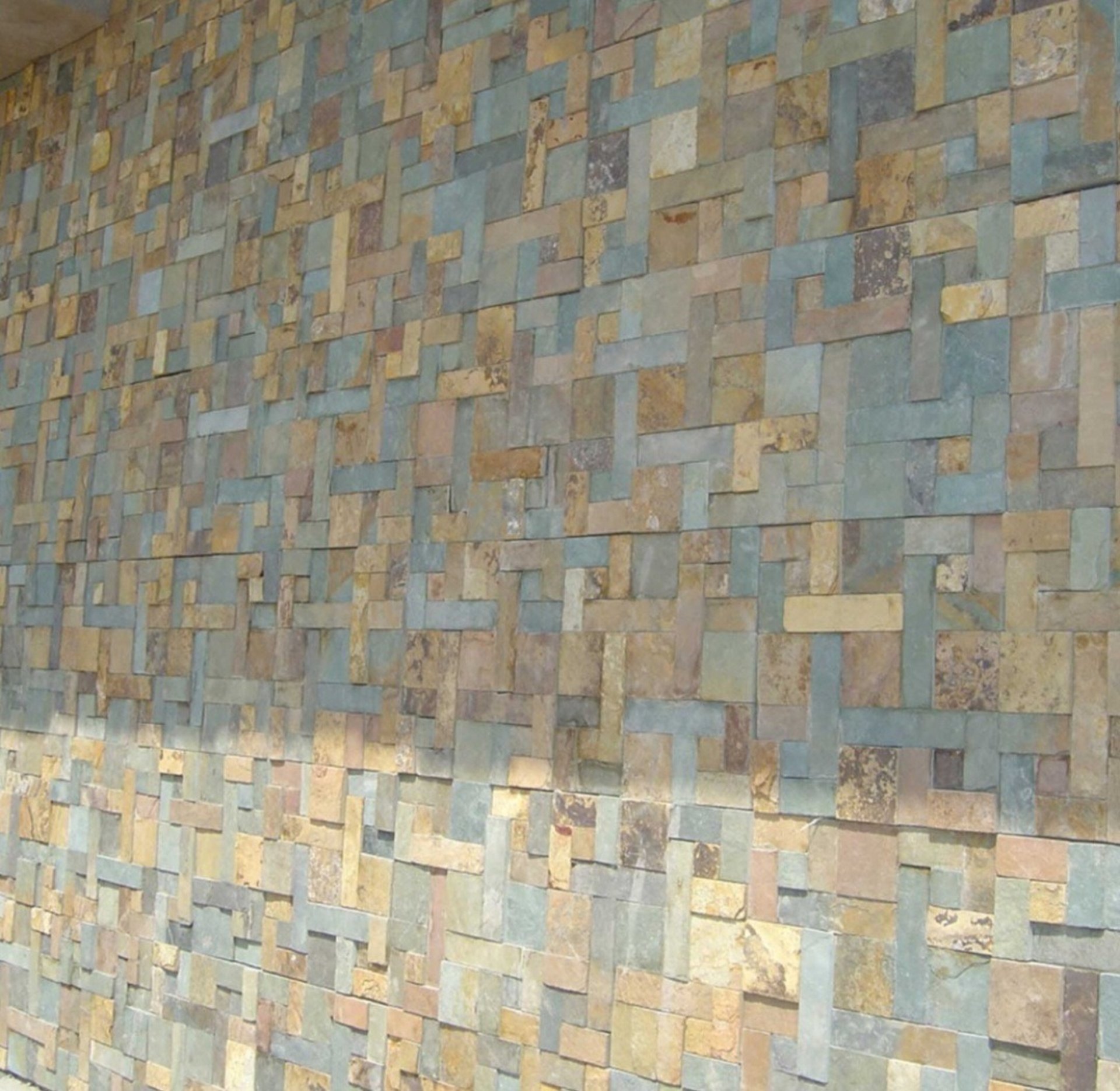 an abstract photo of a curved building with a blue sky in the background