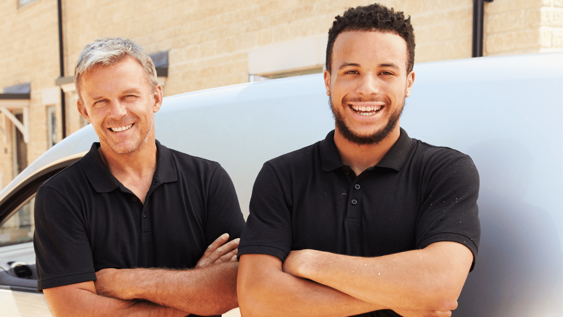 A person in protective suit cleans a carpet.
