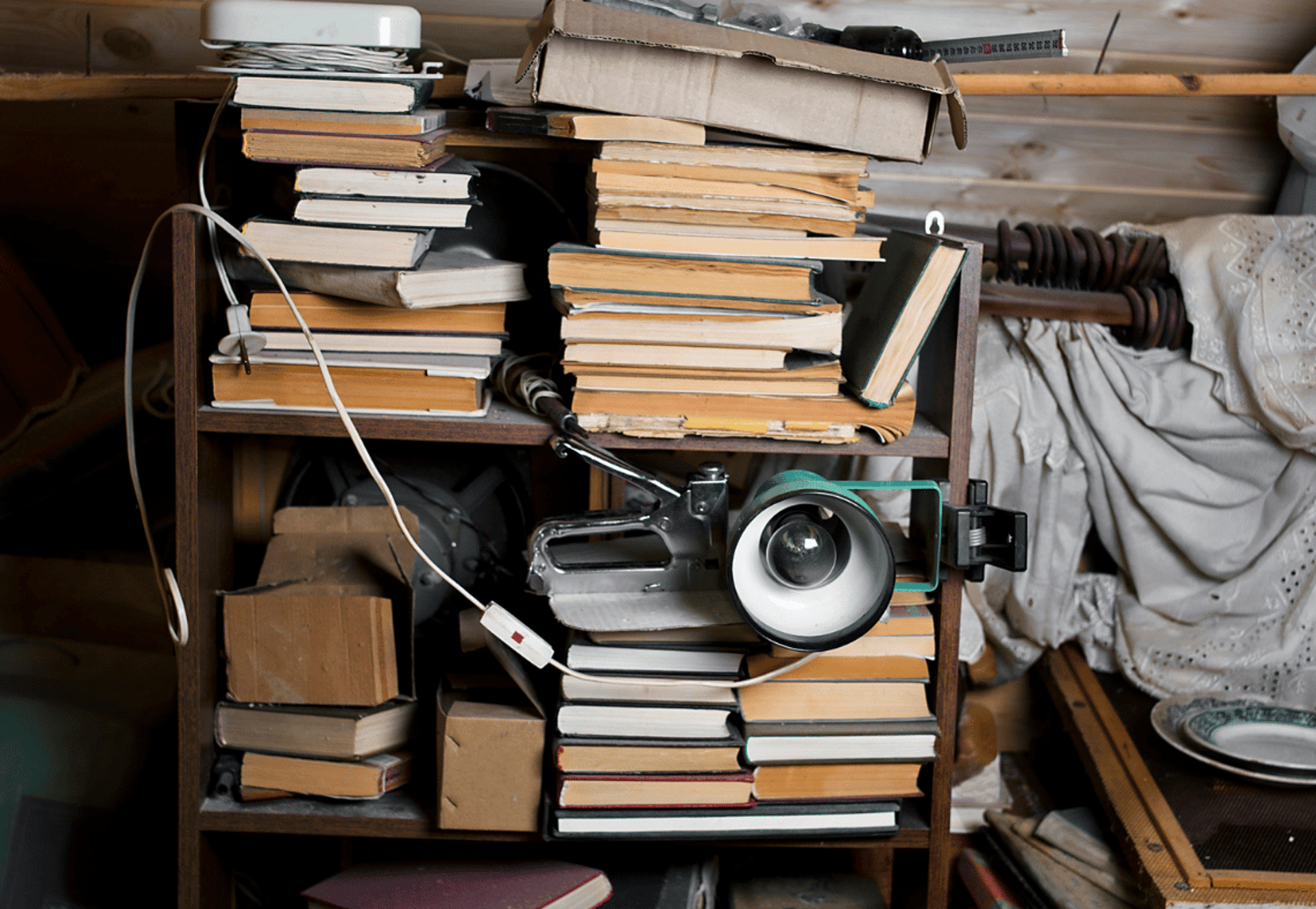 A person in protective suit cleans a carpet.