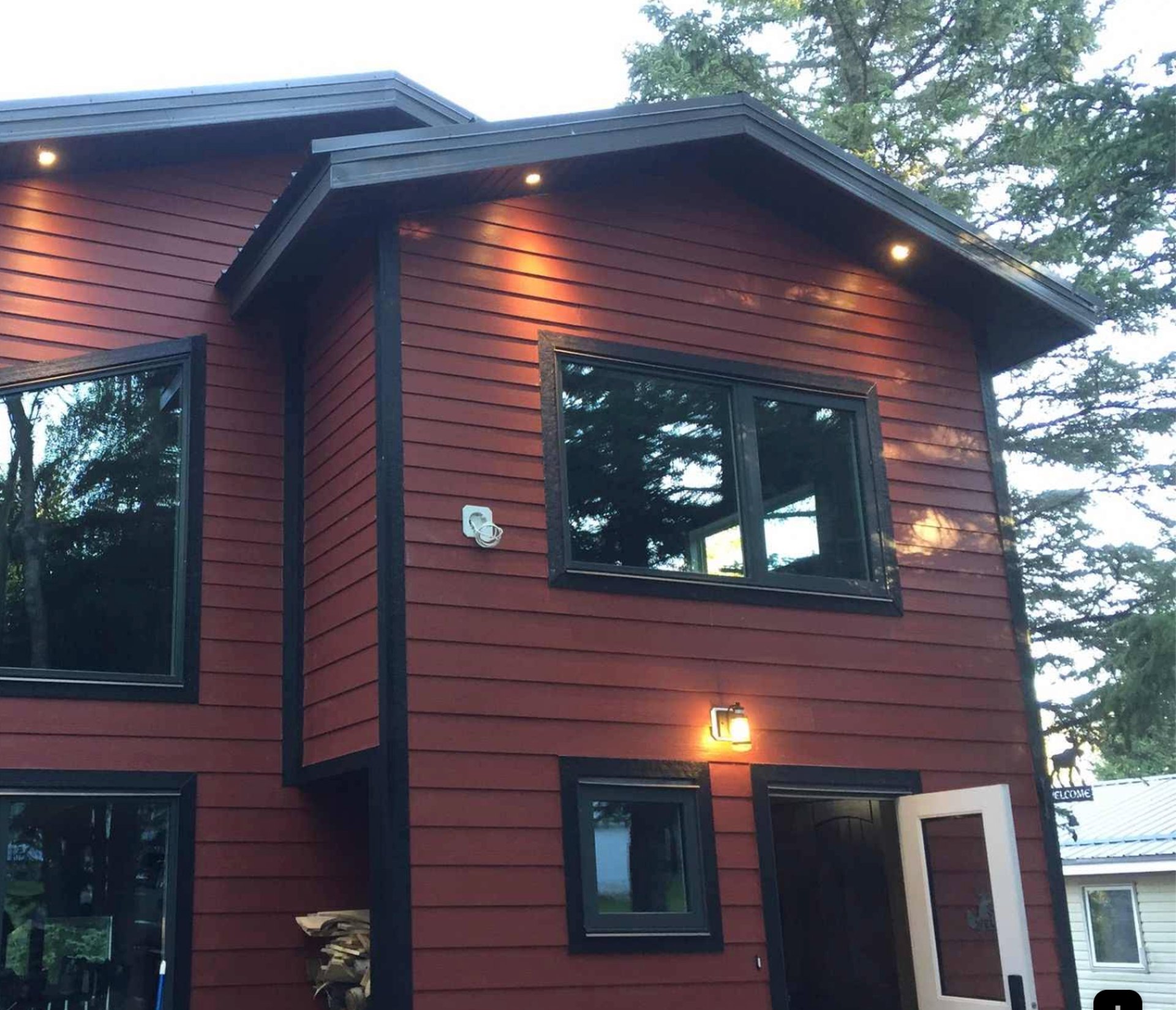 A backyard with a deck and a fence