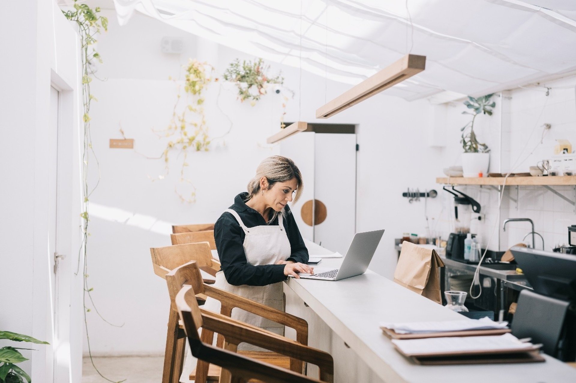 woman wearing yellow long-sleeved dress under white clouds and blue sky during daytime