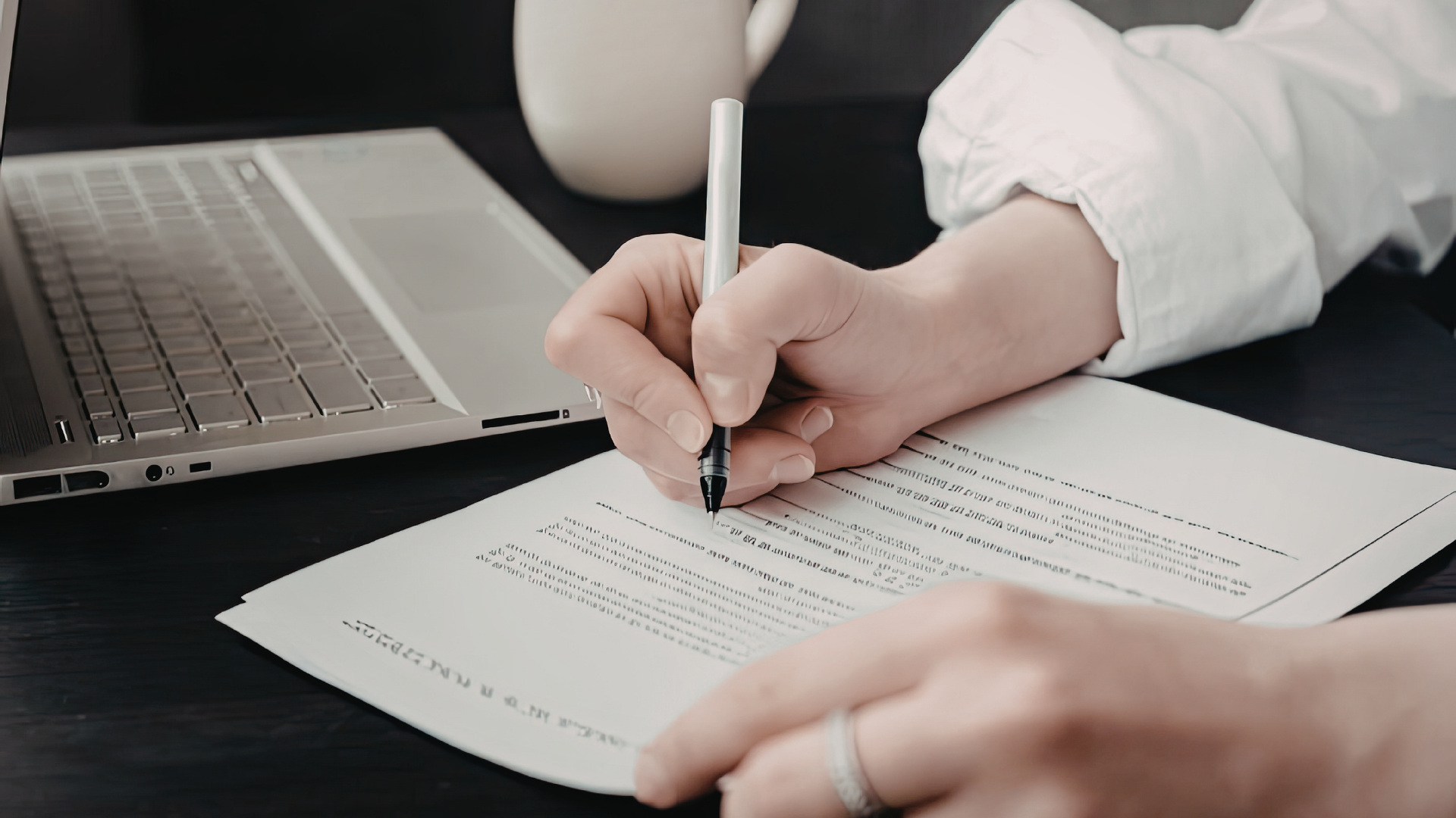 an abstract photo of a curved building with a blue sky in the background