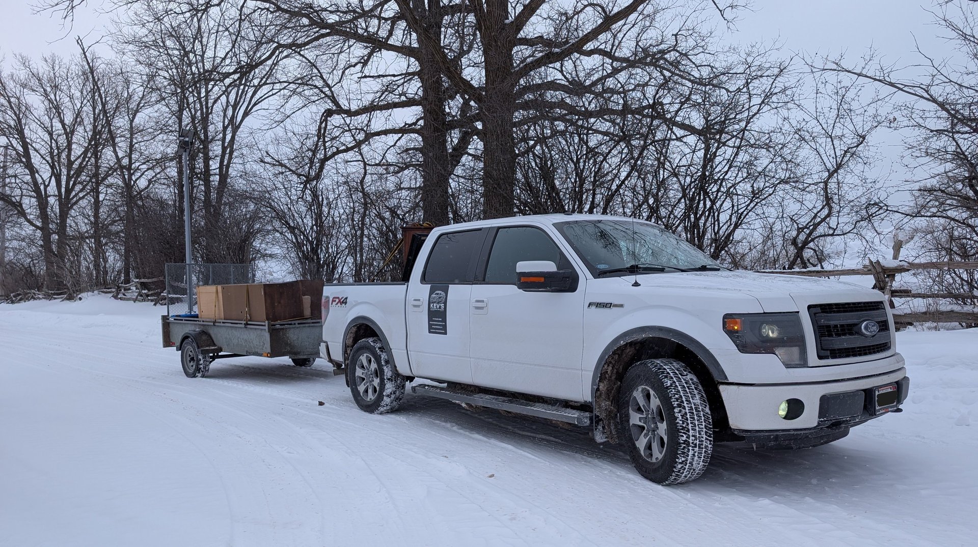 Overflowing dumpster with trash and a sign