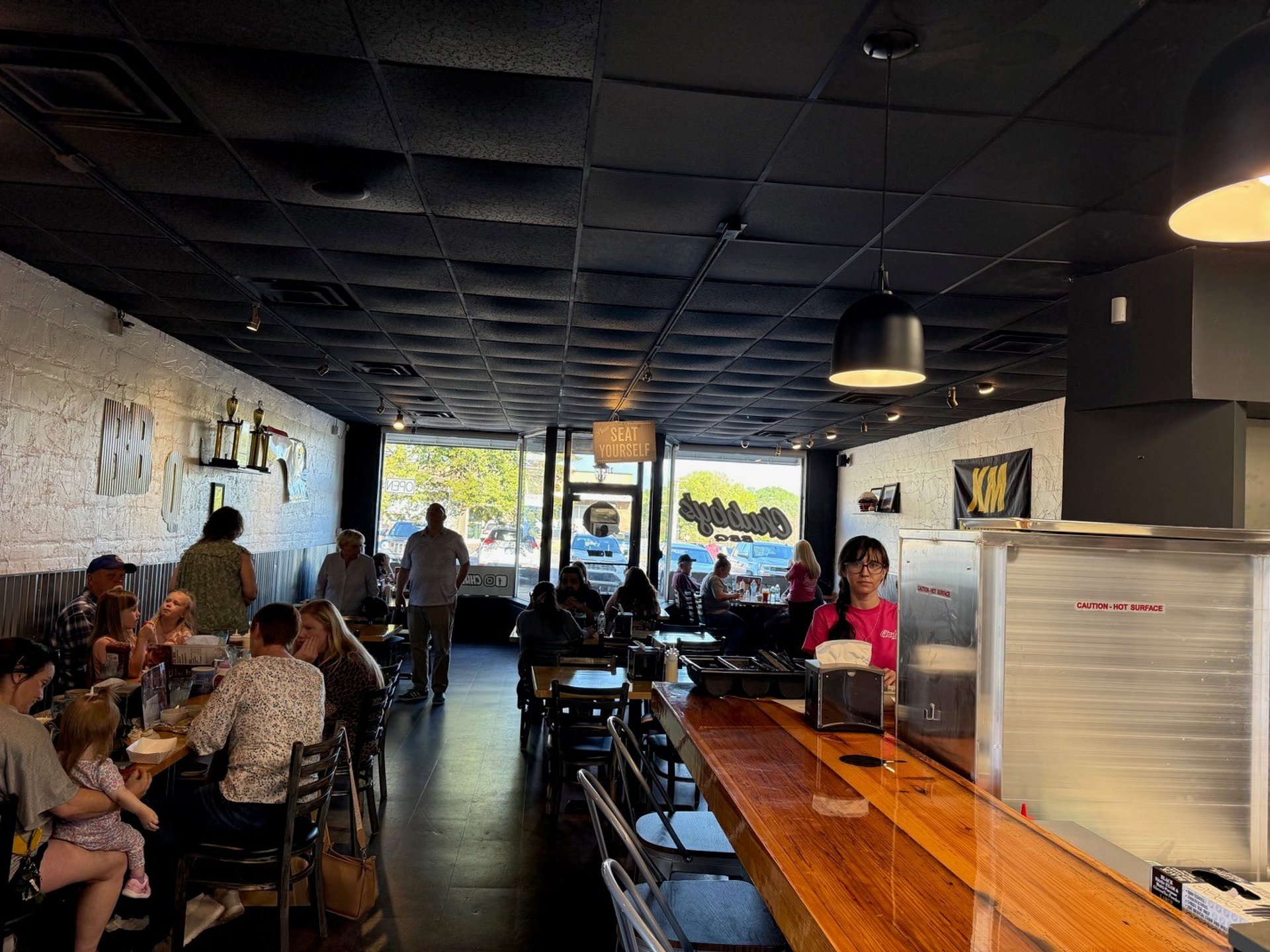 woman wearing yellow long-sleeved dress under white clouds and blue sky during daytime