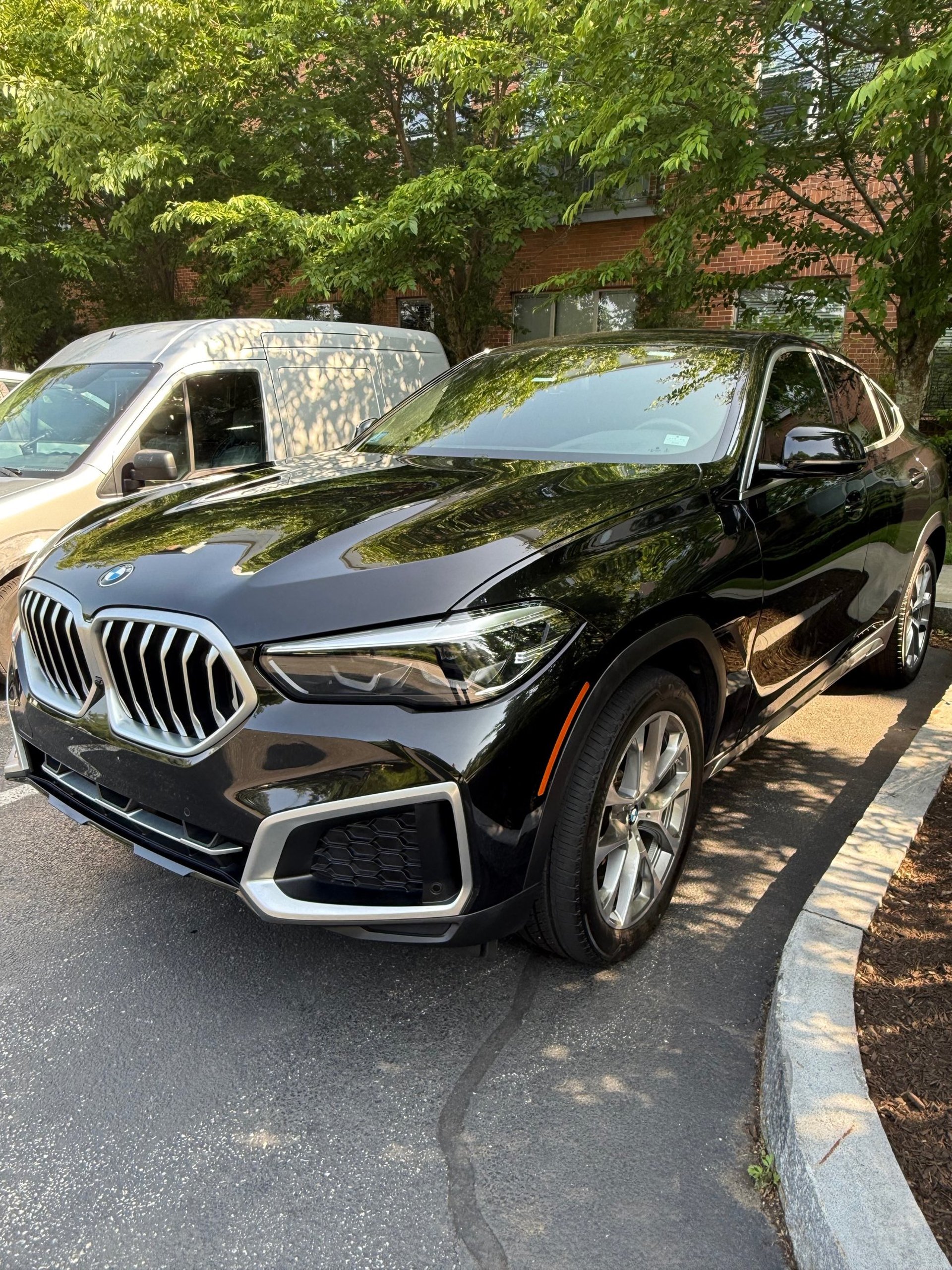 woman wearing yellow long-sleeved dress under white clouds and blue sky during daytime